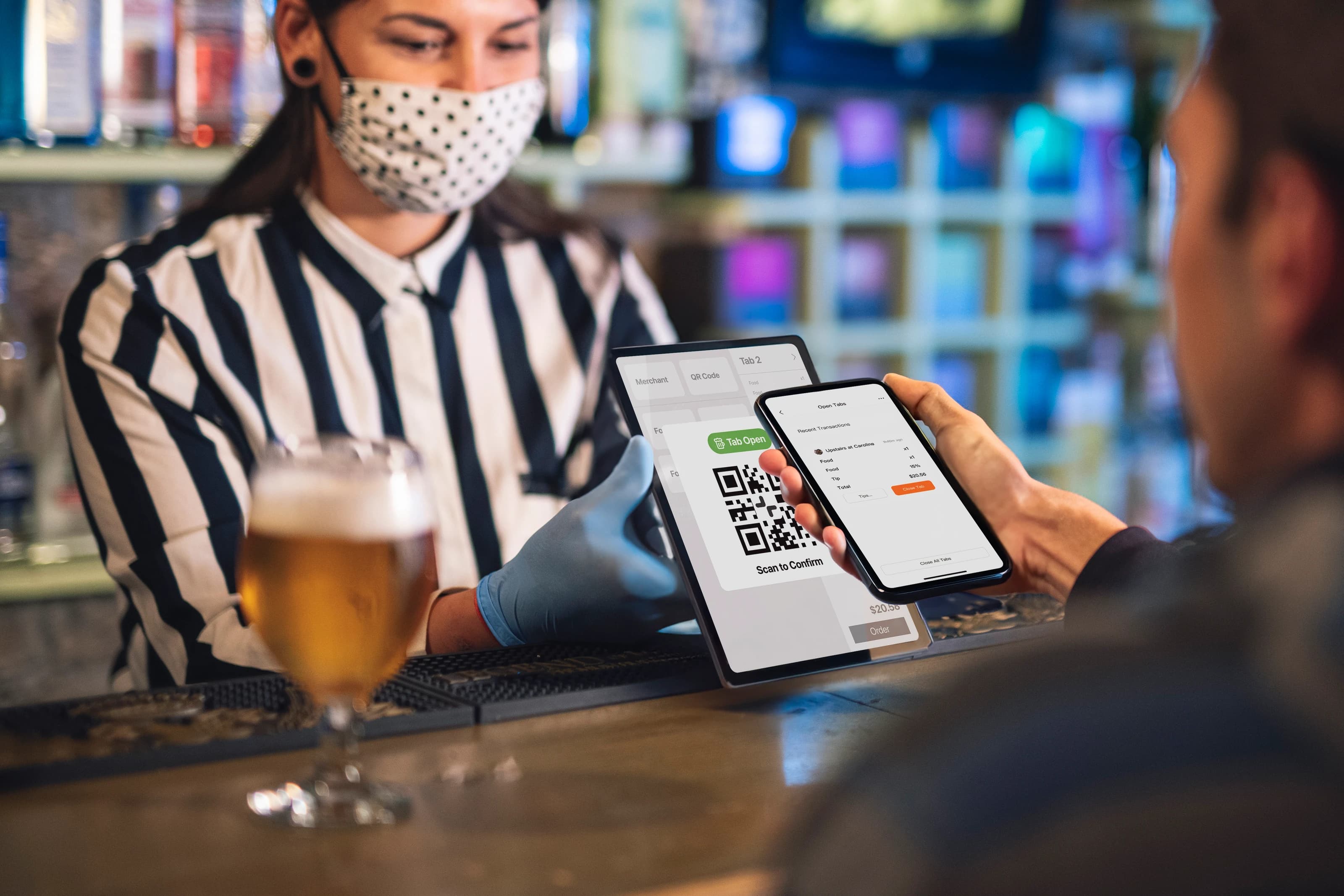 user scans QR code at bar to keep tab open via merchant's PoS